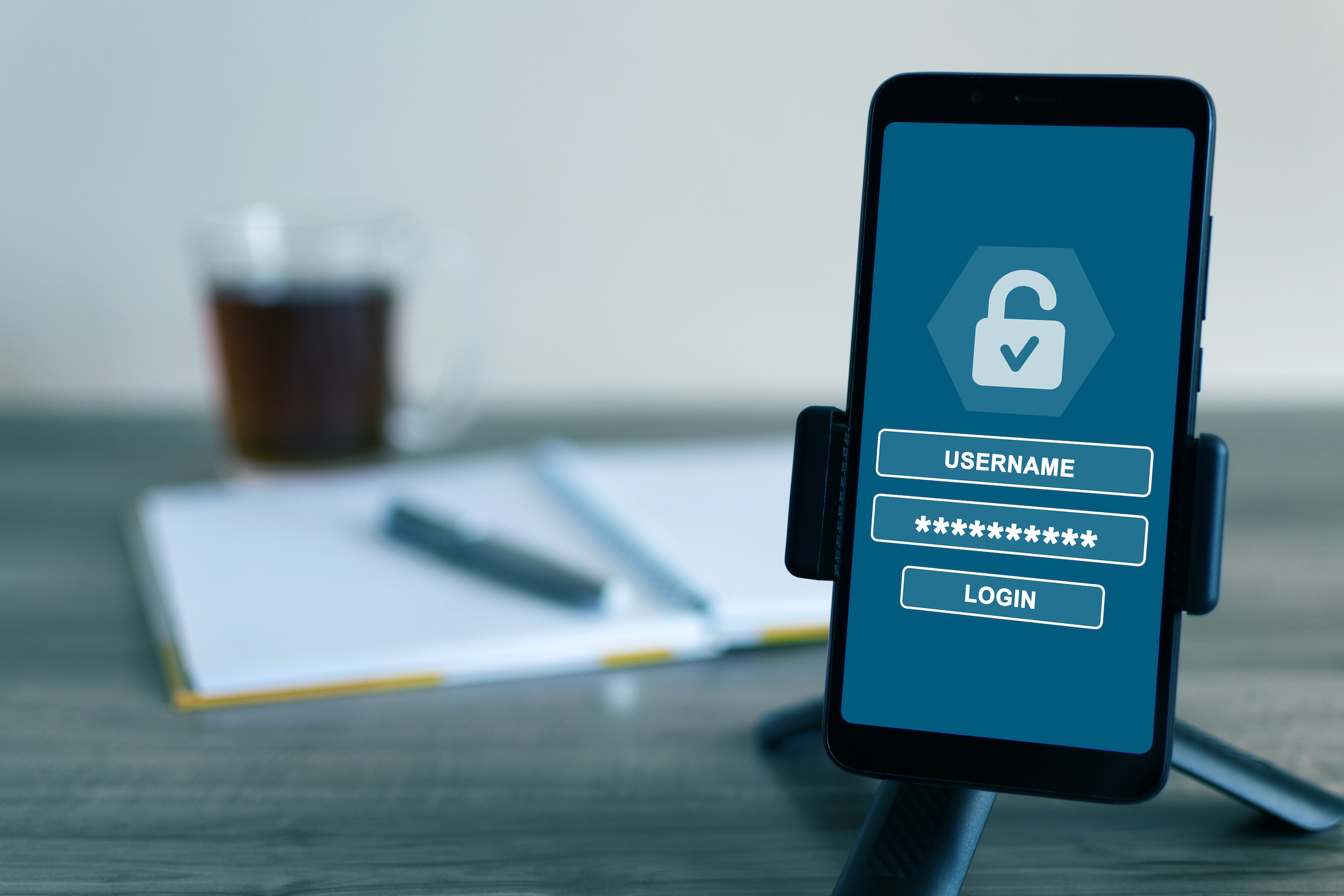 Username and password for login on the screen of a cell phone – cybersecurity concept A username and password for login on the screen of a cell phone - cybersecurity concept